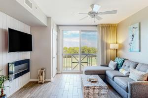 a living room with a couch and a tv at Elation #5416 - Baytowne Breeze in Destin