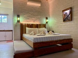a bedroom with a large bed in a room at Hotel Sebastian Panglao in Bolod