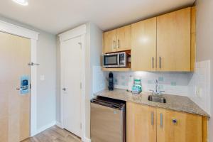 a kitchen with a sink and a microwave at Elation #5416 - Baytowne Breeze in Destin