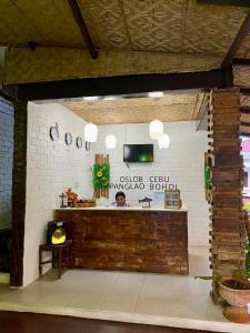 a kitchen with a counter in a brick wall at Hotel Sebastian Panglao in Bolod