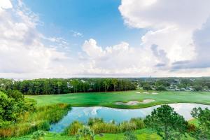 an aerial view of a golf course with a pond at Elation #5416 - Baytowne Breeze in Destin