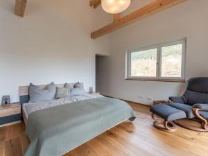 Ένα ή περισσότερα κρεβάτια σε δωμάτιο στο Tasteful holiday home near Ossiacher lake