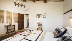 A bed or beds in a room at CASALE TAVERNELLE 6, Emma Villas