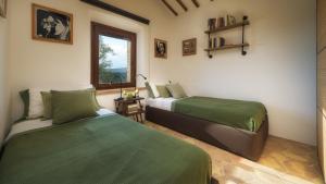 A bed or beds in a room at CASALE TAVERNELLE 6, Emma Villas