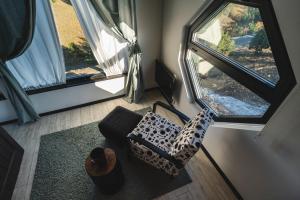 an aerial view of a living room with two large windows at Wild nest Zlatibor Bear in Zlatibor