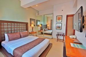 Postel nebo postele na pokoji v ubytování Aloha Boracay Hotel