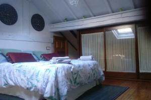 a bedroom with a bed with towels on it at Centro-bahía de Santander. WIFI in Santander