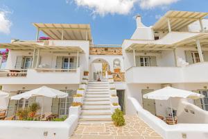 a view of a building with stairs and umbrellas at Studios Strouvalis in Agiassos