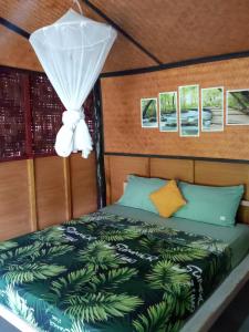 Postel nebo postele na pokoji v ubytování New Andaman Bay Bungalow