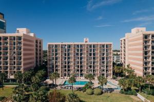 an aerial view of two tall buildings and a pool at Sandcastle Oceanfront Resort at the Pavilion in Myrtle Beach