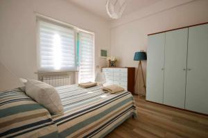 A bed or beds in a room at BLUE BAY Lussuoso A due passi dal mare