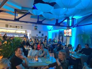 a group of people sitting at tables in a restaurant at Športové a relaxačné centrum - ŠRC in Stará Ľubovňa