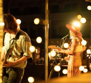 a man and a woman playing a guitar on a stage at INNSiDE by Meliá Costablanca - Adults recommended in Benidorm