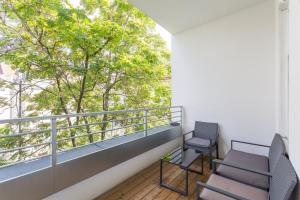 A balcony or terrace at Luxury / special for families/ Vienna town hall