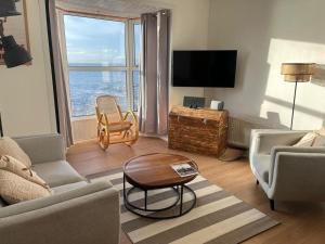 a living room with a view of the ocean at The Cranny, Portstewart in Portstewart