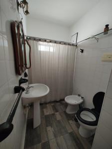 a bathroom with a toilet and a sink at Amplio 3 Ambientes Zona Centro in Mar del Plata +9 photos