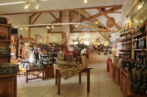 a store filled with lots of bottles of wine at LOU FILADOUR 6 personnes 1er étage in Jausiers
