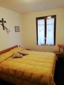 Postel nebo postele na pokoji v ubytování CASA ILARIA