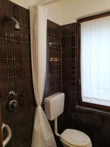 Koupelna v ubytování CASA ILARIA + 15 fotografií