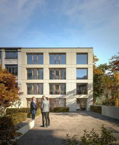 two men standing in front of a building at ipartment Hamburg Eimsbuettel in Hamburg