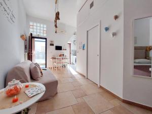 a living room with a couch and a table at Casa vacanze LaCorte ByFrancy in Bari