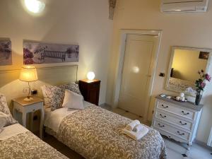 Postel nebo postele na pokoji v ubytování Porta Piccola B&B