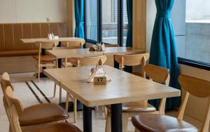 a row of tables and chairs in a restaurant at G.C ROYAL HOTEL in Accra +41 photos