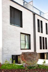 a building with a bench in front of it at Reckenthal House by Rentaroo in Luxembourg