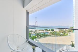 a balcony with a view of the ocean at Address Beach Residences in Dubai