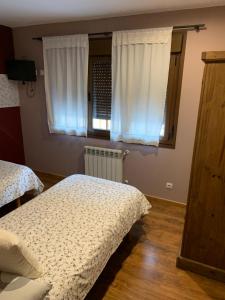 A bed or beds in a room at El Molin de Eloy