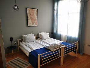 Ένα ή περισσότερα κρεβάτια σε δωμάτιο στο Radomir Downtown Apartments