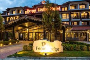 a peroni lodge hotel with a sign in front of it at Luxury Studio in Hotel Perun Lodge SPA in Bansko