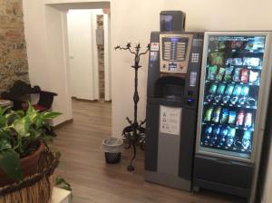a vending machine with soda bottles in a room at Affittacamere Superior del Golfo e delle 5 Terre in La Spezia