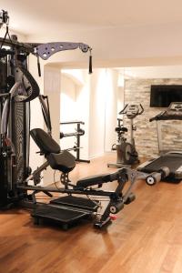 a gym with several tread machines in a room at Stay2Night BS in Zurich