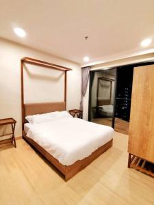 a bedroom with a bed and a large window at Timurbay Beach Resort Balok Kuantan in Kampung Sungai Karang +42 photos