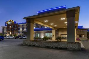 a building with a parking lot in front of it at Comfort Inn & Suites Coeur d'Alene in Coeur d'Alene