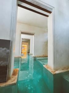 an empty room with water in the floor at Lamu penthouse Apartment in Lamu