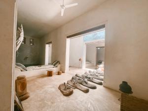 a room with a group of shoes on the floor at Lamu penthouse Apartment in Lamu