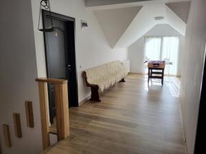 a living room with a couch and a table at Casa Berbece in Moieciu de Jos