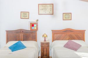 A bed or beds in a room at Es Pujols