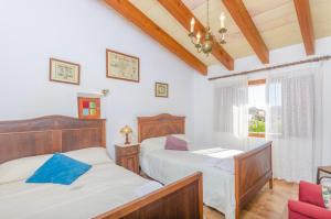 A bed or beds in a room at Es Pujols