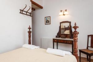 A bed or beds in a room at Es Pujols