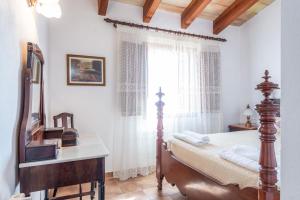 A bed or beds in a room at Es Pujols