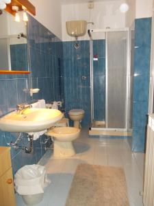 a bathroom with a sink and a toilet and a shower at Albergo Boccadasse in Genoa