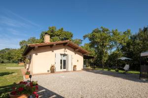 A garden outside Villino il Campone by VacaVilla