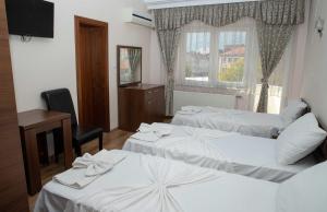 Cama o camas de una habitación en Hotel Leo