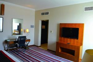 Een TV en/of entertainmentcenter bij Wonder Palace Hotel Qatar
