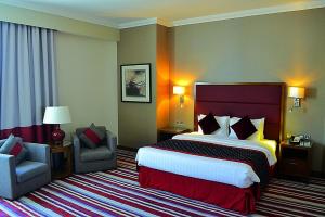 Een bed of bedden in een kamer bij Wonder Palace Hotel Qatar