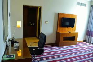 Een TV en/of entertainmentcenter bij Wonder Palace Hotel Qatar
