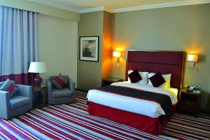 Een bed of bedden in een kamer bij Wonder Palace Hotel Qatar